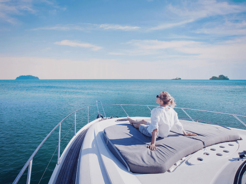 yacht stewardess on the bow of a yacht